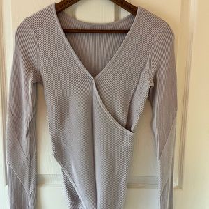 Lululemon yoga sweater. Size 0 in lavender. Used, but in great condition.
